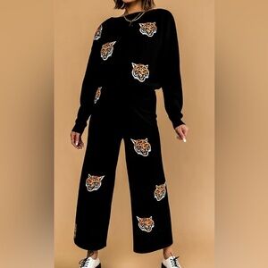 Dressed in LALA Black Tiger Print Wide Leg Pants!